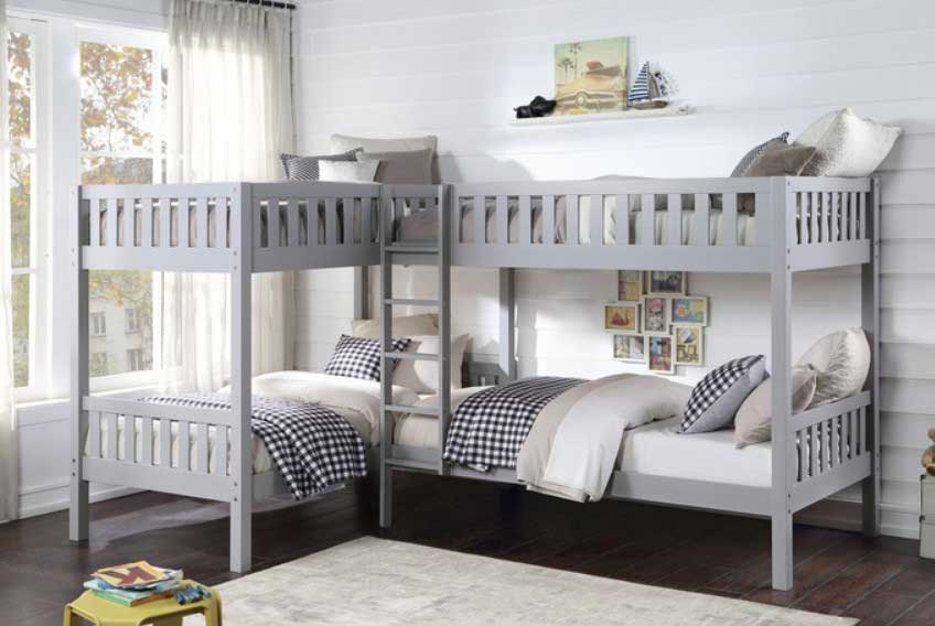  L-shaped wooden bunk bed with twin beds and open shelving in a cozy children's room