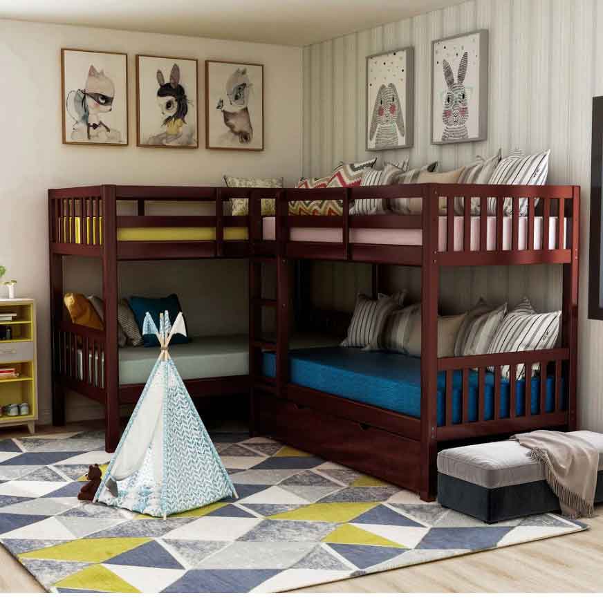 Stylish L-shaped bunk bed for kids featuring a trundle and cozy setup with pillows and playful decor.