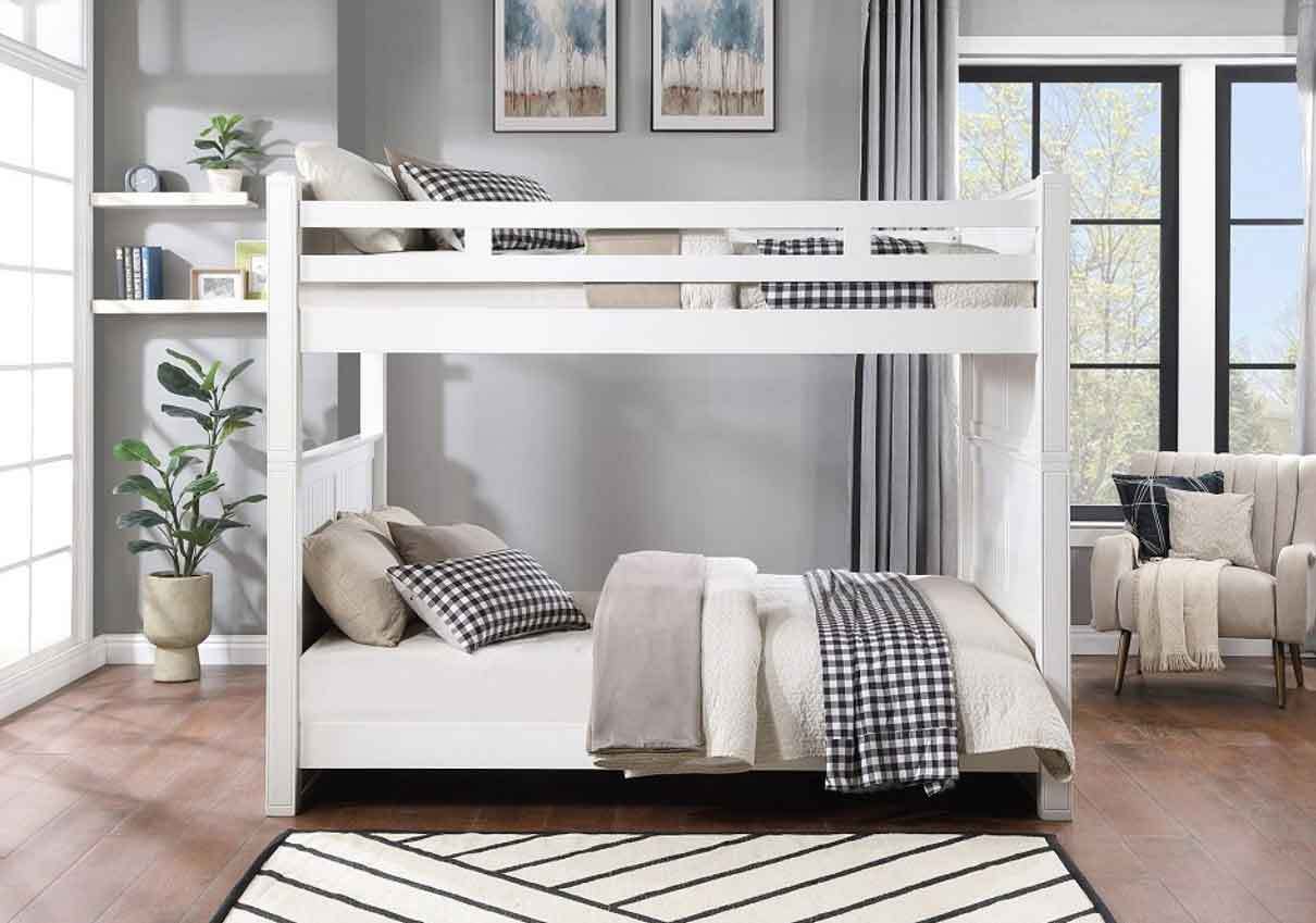 White wooden queen bunk bed with beadboard detailing, styled in a cozy modern bedroom